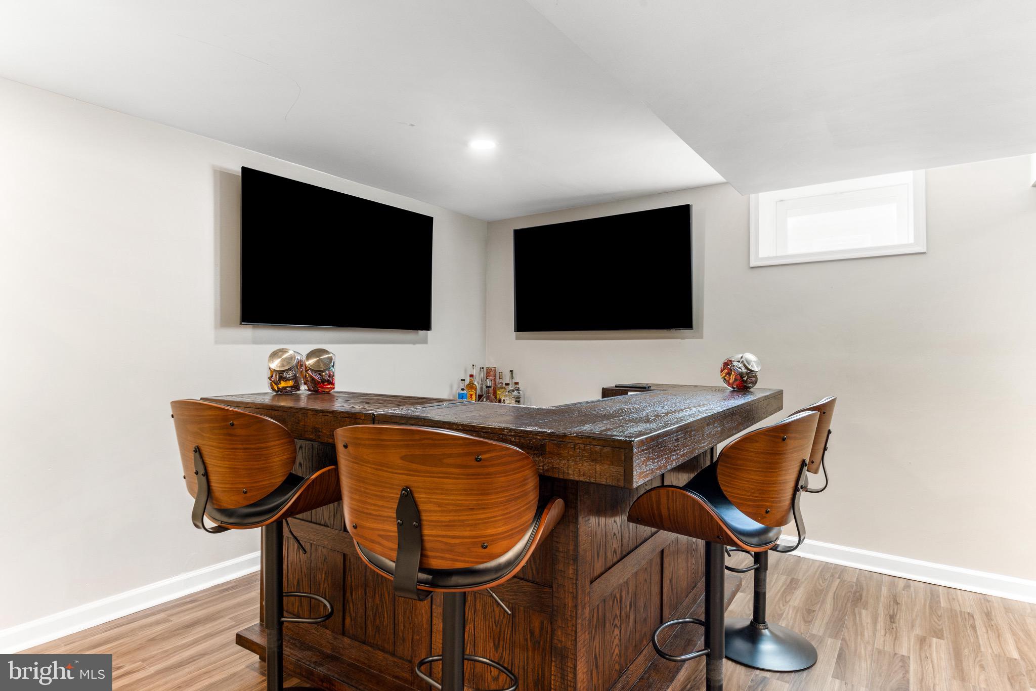 586 Forest View Road Linthicum Heights, MD 21090 - Photo 21 of 28 a living room with furniture and a flat screen tv