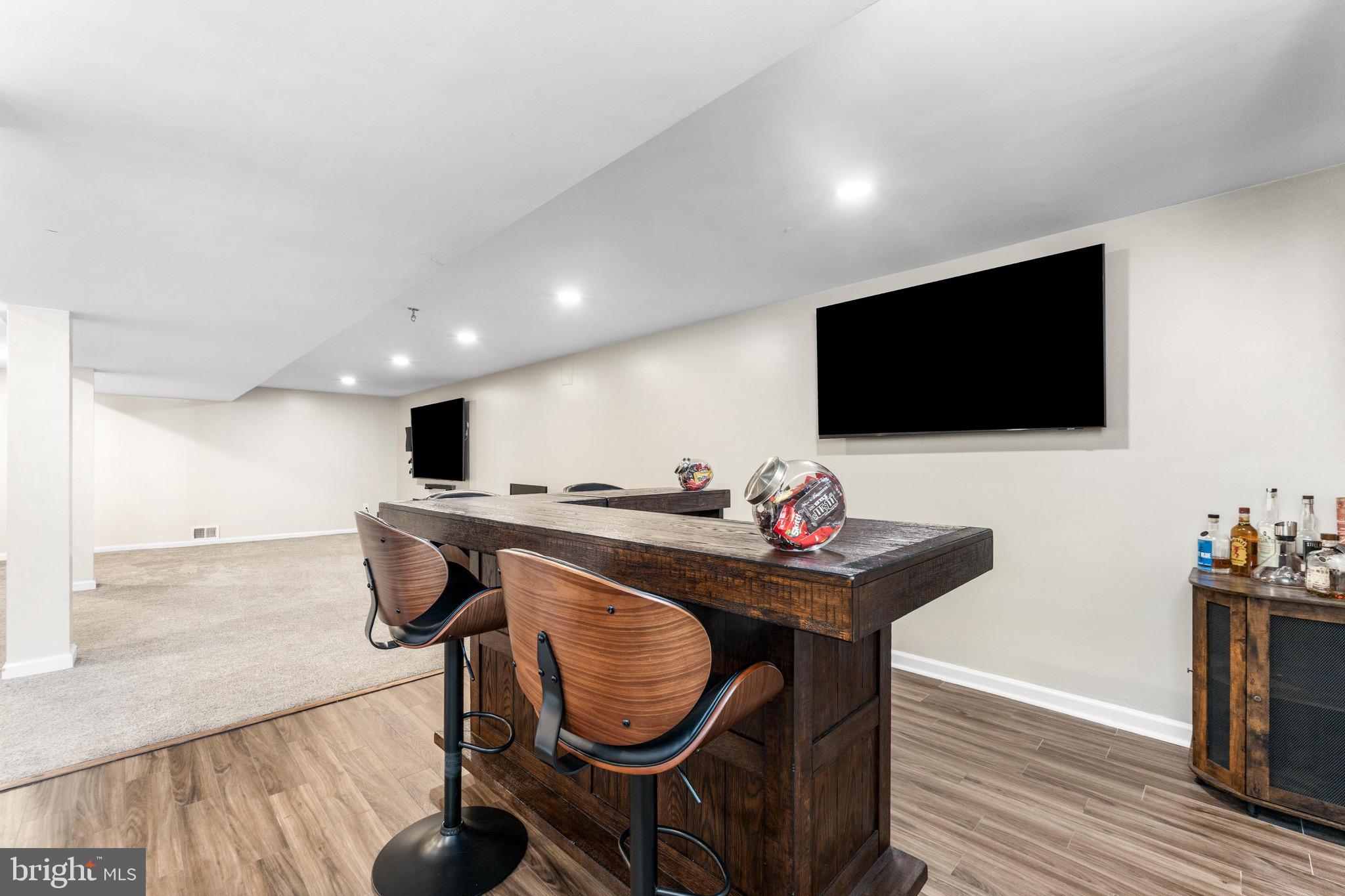 586 Forest View Road Linthicum Heights, MD 21090 - Photo 22 of 28 a living room with furniture and a flat screen tv
