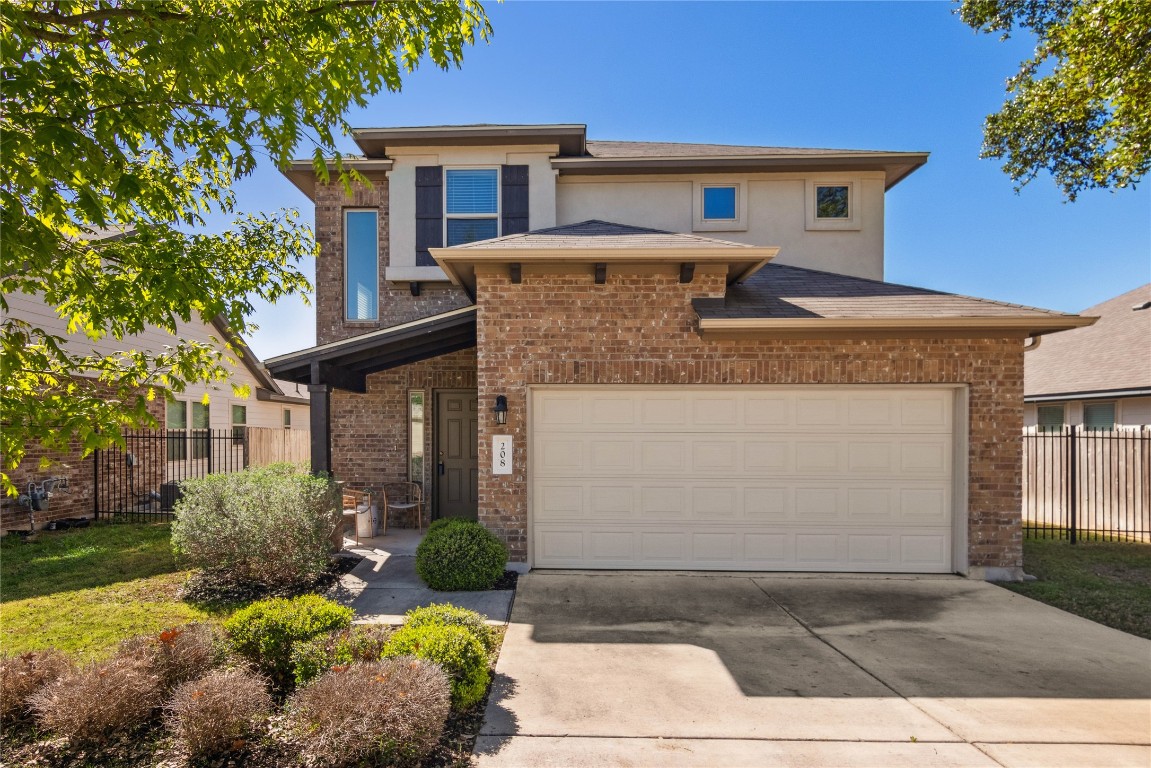 208 Callahan Lane Leander, TX 78641 - Photo 1 of 1 a front view of a house with a yard