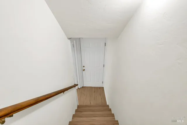 a view of room with window and stairs