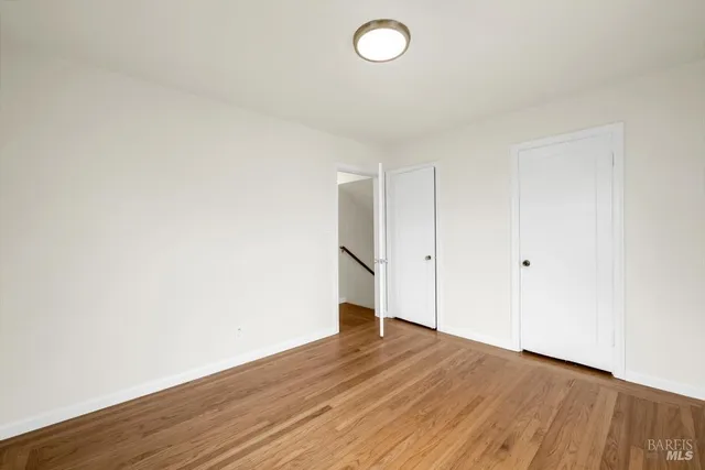 a bathroom with a tub a sink and a large mirror