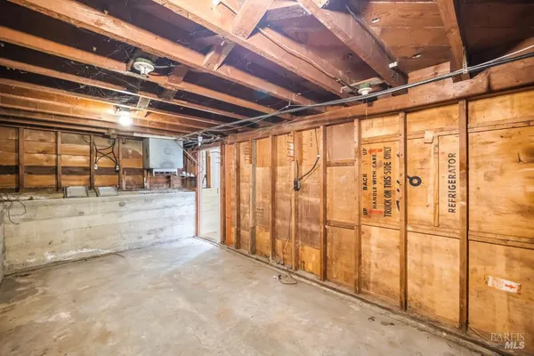 a view of a balcony with wooden floor and fence