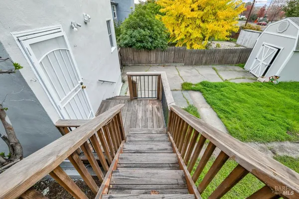 a view of a house with a yard and pathway