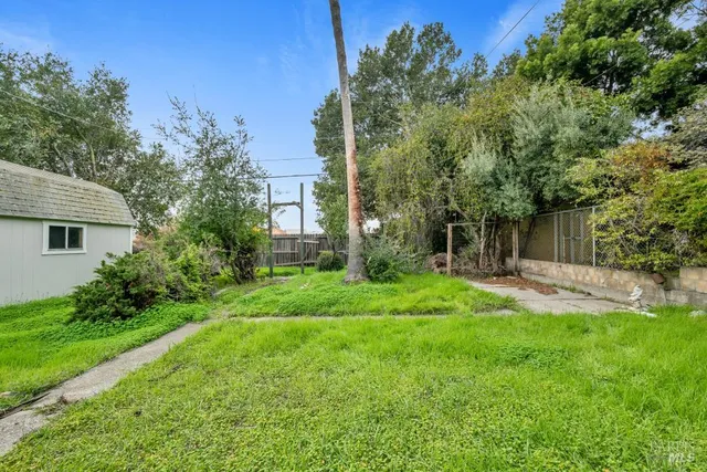 a sign board with a yard