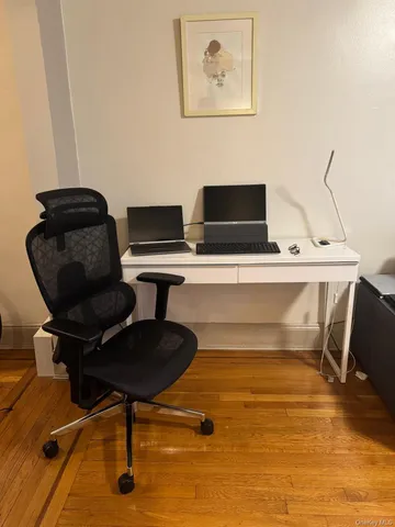 a workspace with furniture and screen
