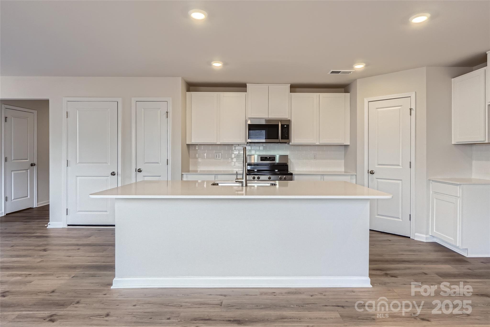 2482 Trollinger Drive Catawba, NC 28609 - Photo 5 of 14 a kitchen with stainless steel appliances granite countertop a stove a sink and a refrigerator