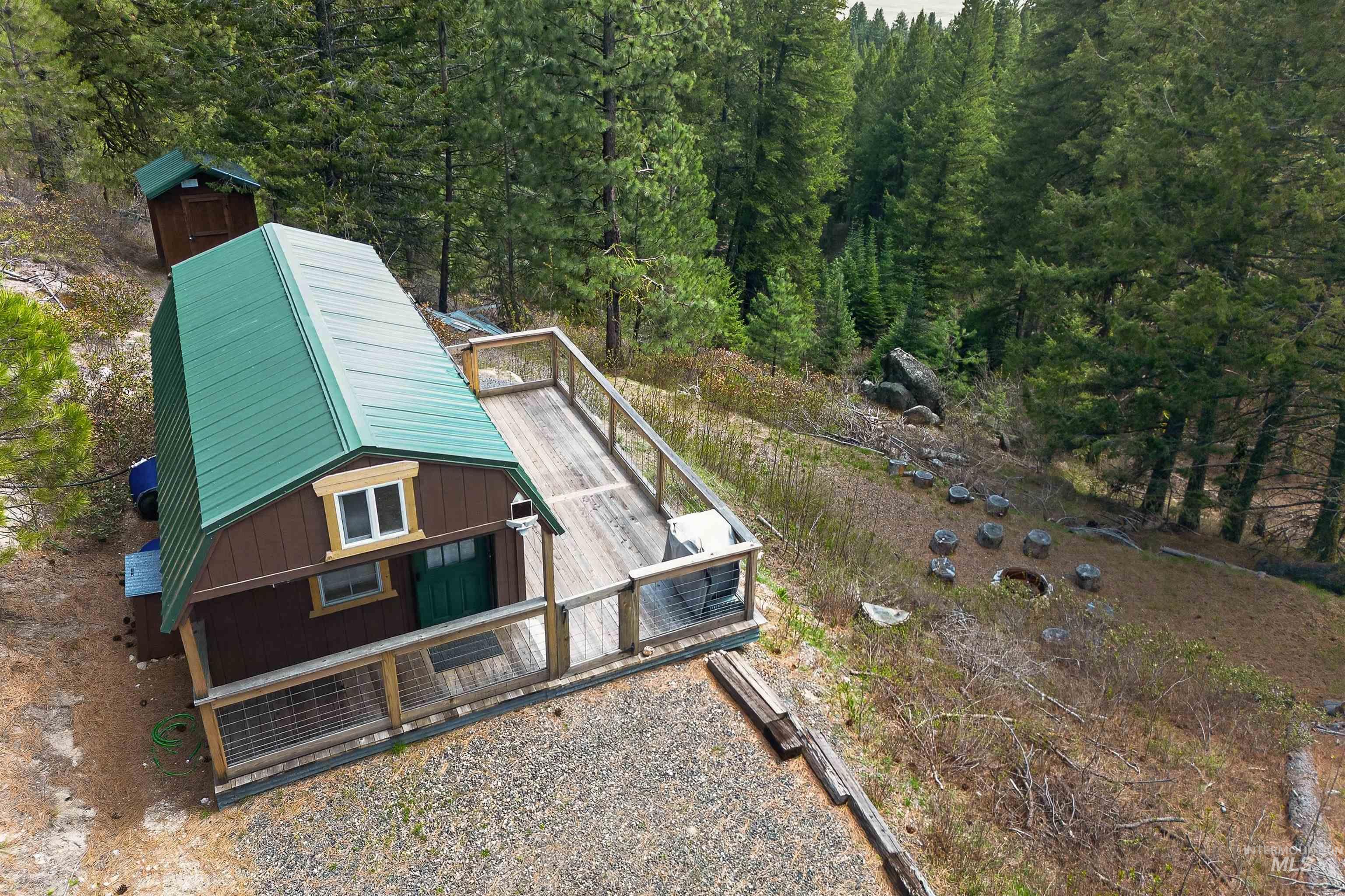 506 Hilltop Road Cascade, ID 83611 - Photo 18 of 36 View from above of property featuring a forest