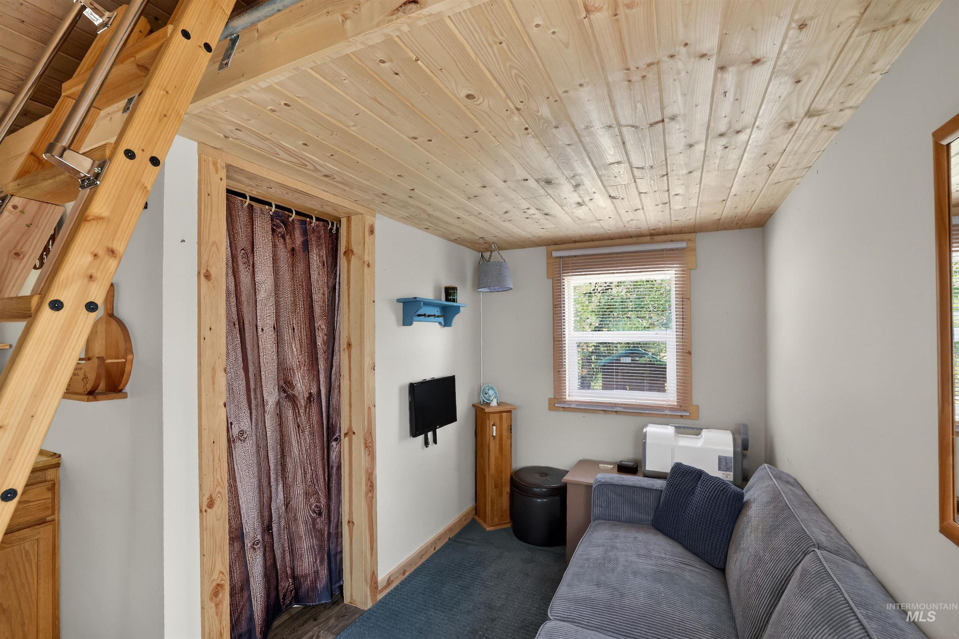 506 Hilltop Road Cascade, ID 83611 - Photo 9 of 36 Living room with wooden ceiling and baseboards