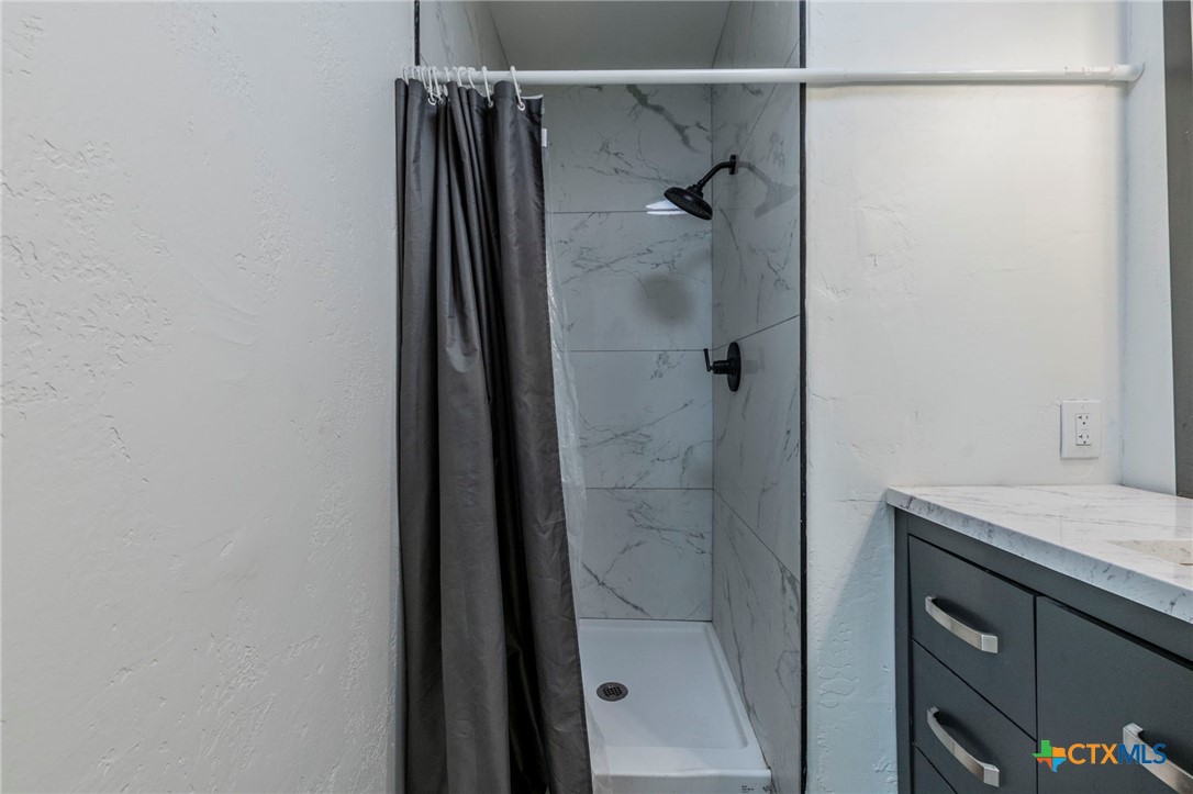 4013 Valley View Drive Temple, TX 76502 - Photo 14 of 25 a bathroom with a shower and a sink