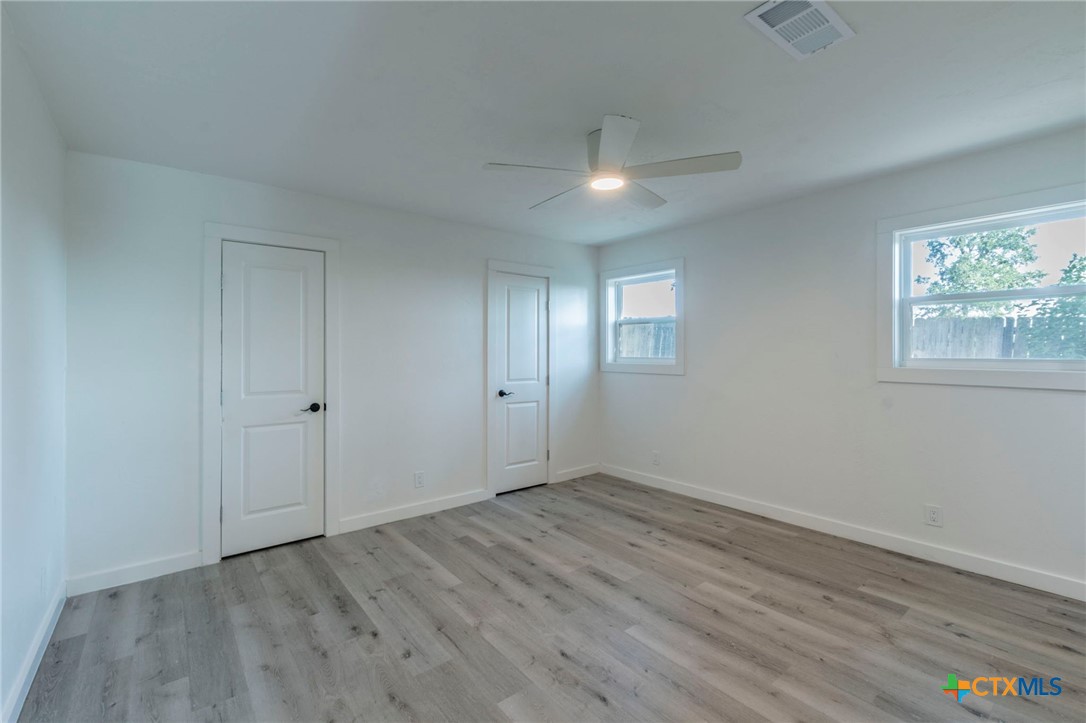 4013 Valley View Drive Temple, TX 76502 - Photo 19 of 25 a view of an empty room with wooden floor and a window
