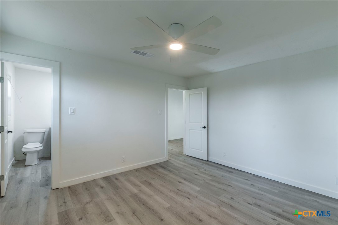 4013 Valley View Drive Temple, TX 76502 - Photo 20 of 25 a view of room with wooden floor and toilet