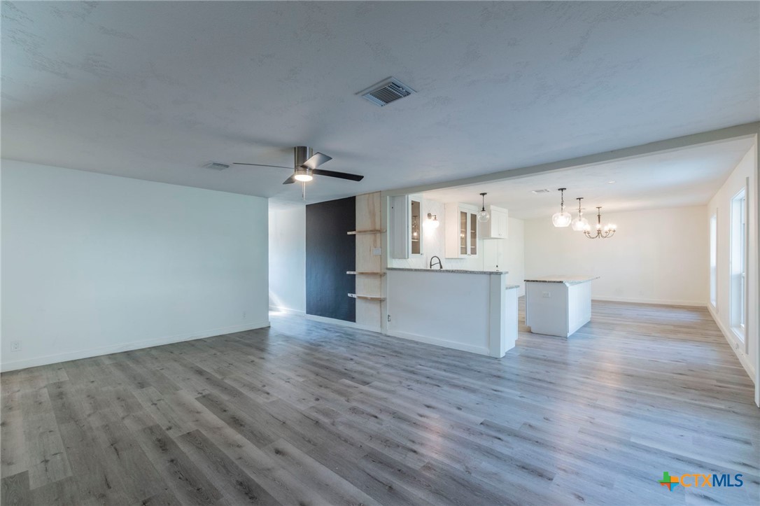 4013 Valley View Drive Temple, TX 76502 - Photo 4 of 25 a view of a kitchen with wooden floor and windows