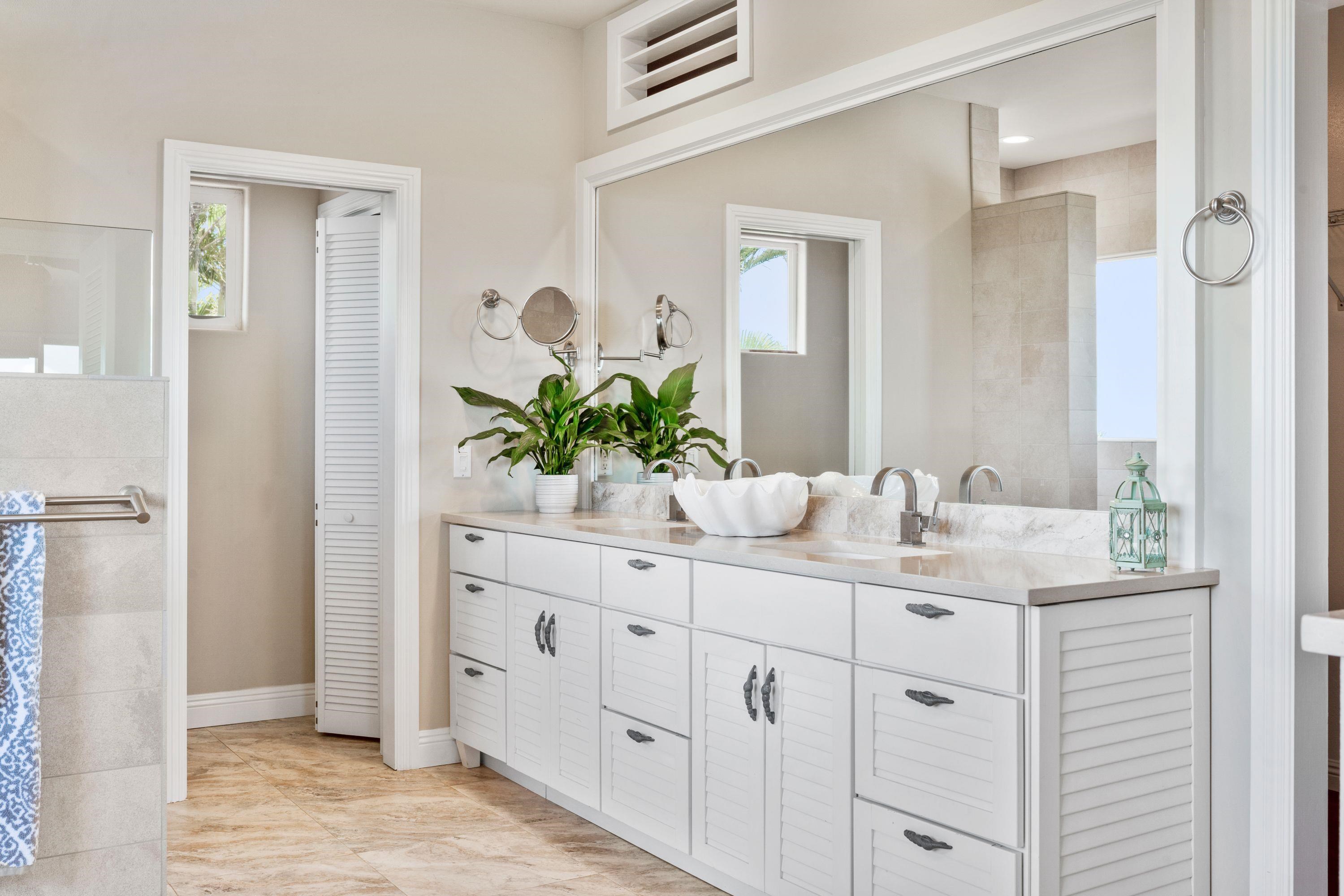 500 North Holokai Place Haiku, HI 96708 - Photo 17 of 30 a bathroom with a sink and a mirror
