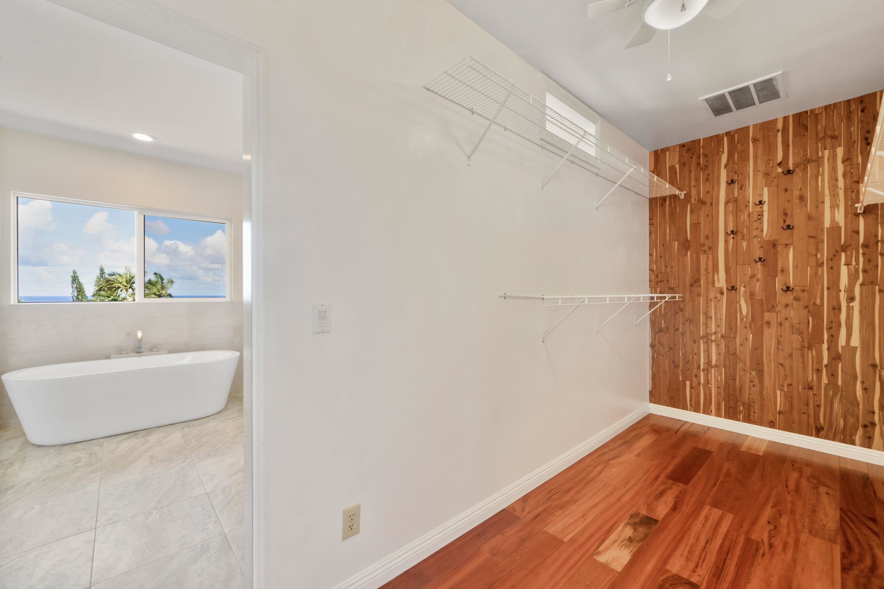 500 North Holokai Place Haiku, HI 96708 - Photo 18 of 30 a bathroom with a sink and a mirror