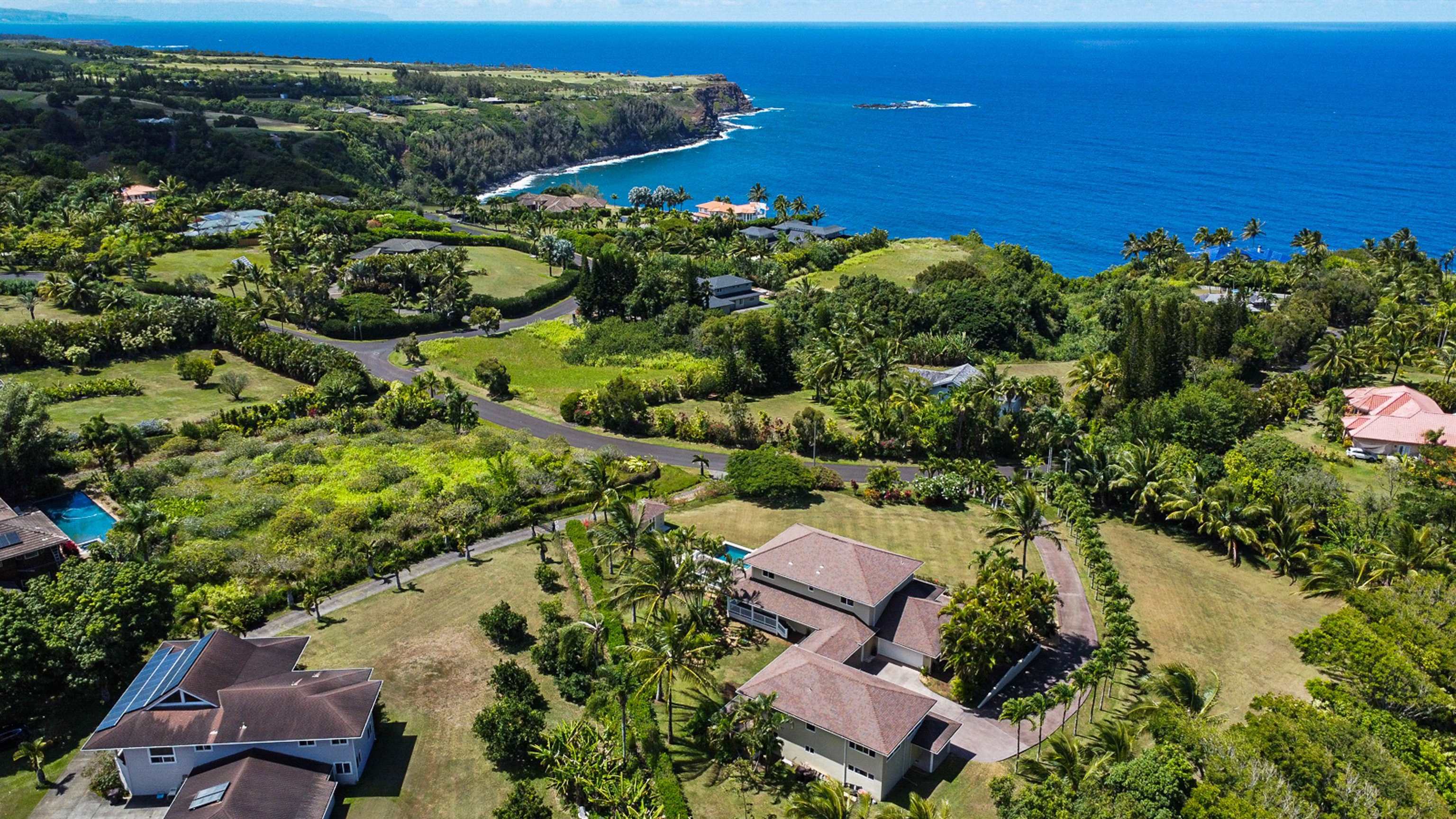 500 North Holokai Place Haiku, HI 96708 - Photo 2 of 30 a view of a lake with a house