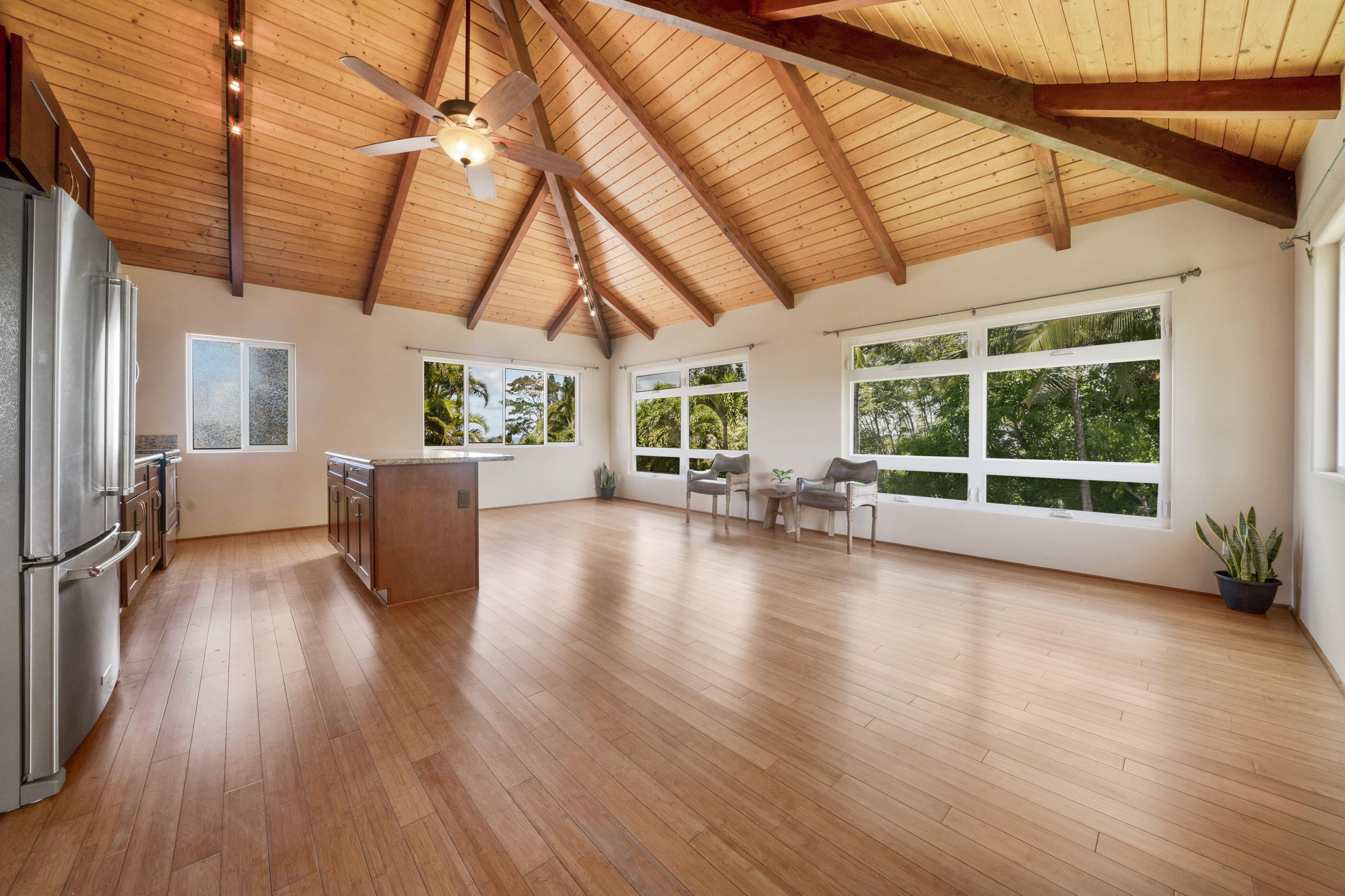 500 North Holokai Place Haiku, HI 96708 - Photo 23 of 30 a view of a livingroom with furniture wooden floor and windows