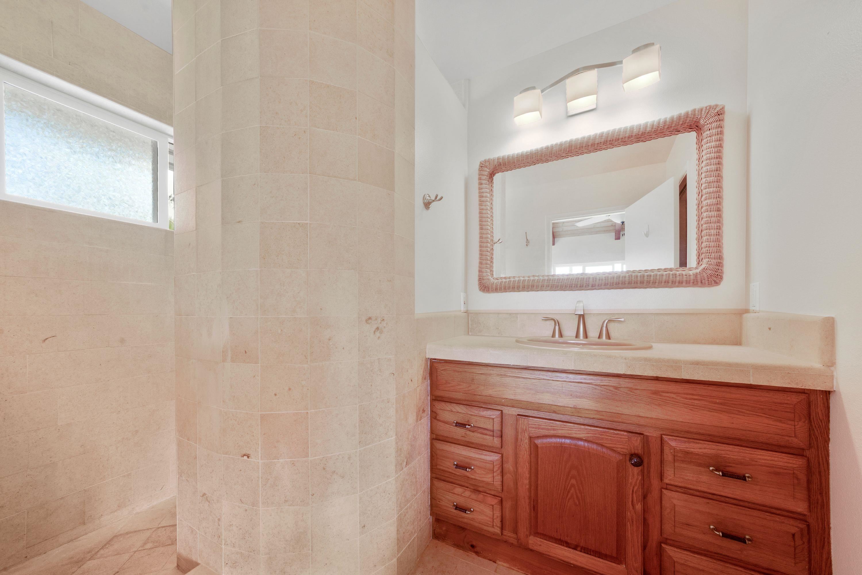 500 North Holokai Place Haiku, HI 96708 - Photo 26 of 30 a bathroom with a sink and a mirror