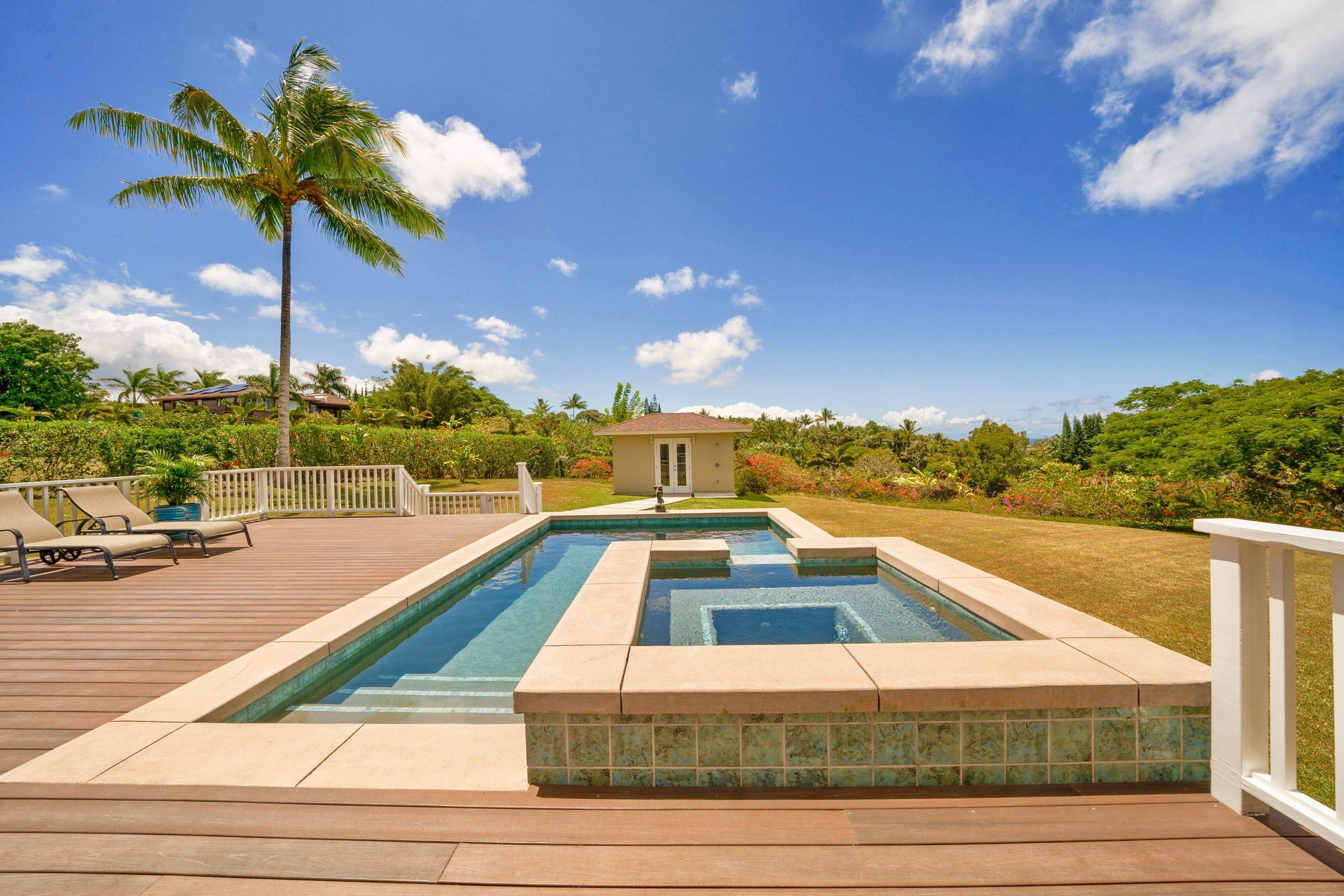 500 North Holokai Place Haiku, HI 96708 - Photo 3 of 30 a view of a swimming pool with a lounge chairs