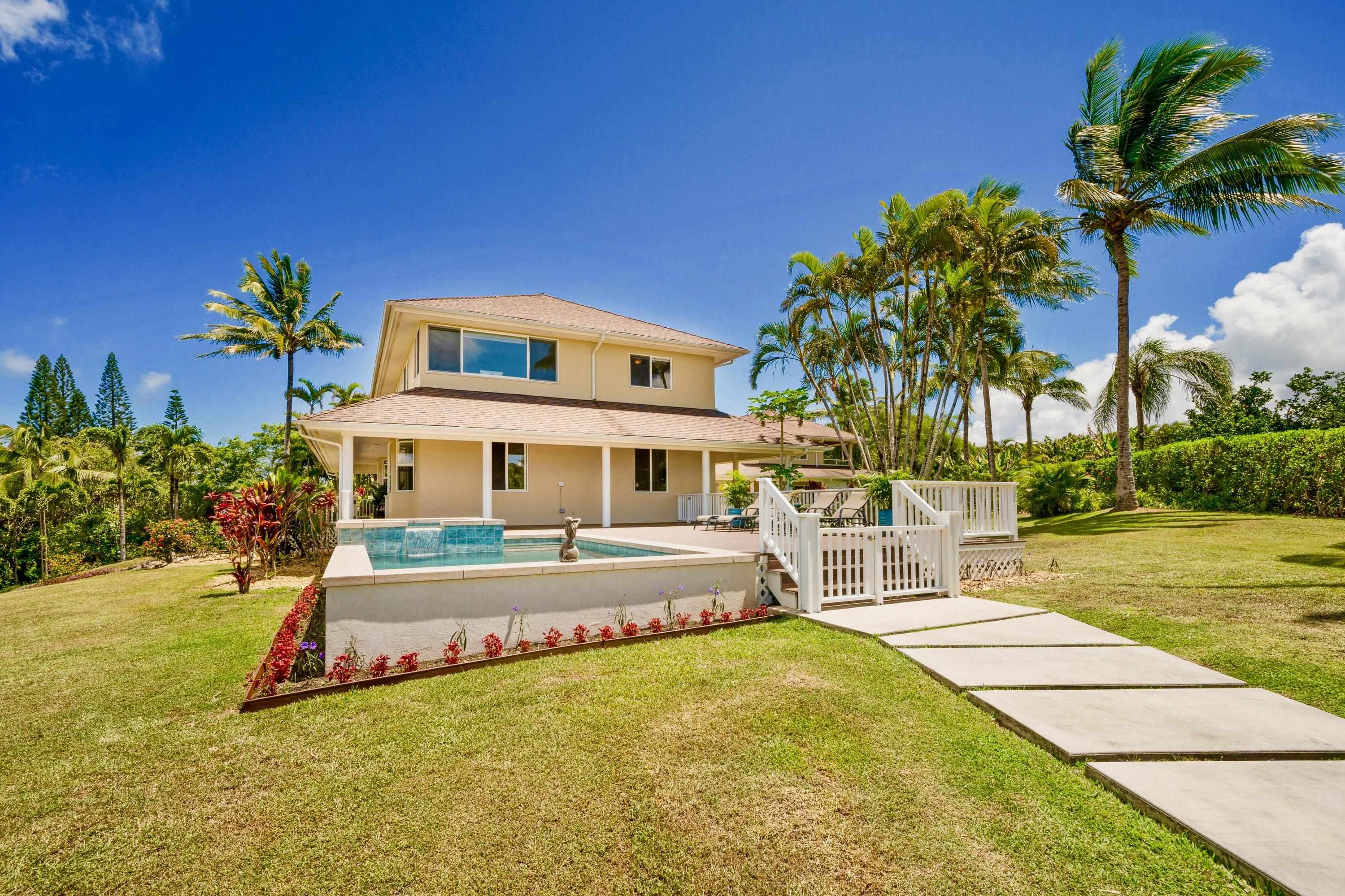 500 North Holokai Place Haiku, HI 96708 - Photo 5 of 30 a front view of house with yard and swimming pool