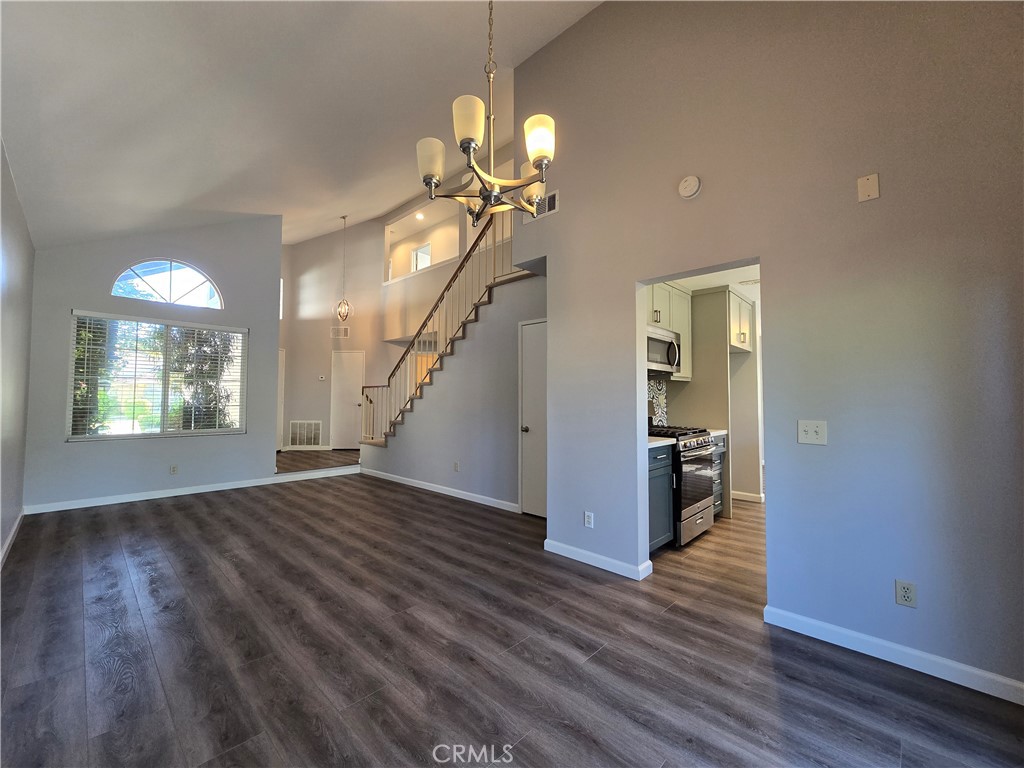 6731 Dove Lane Riverside, CA 92506 - Photo 8 of 28 wooden floor in an empty room with a window