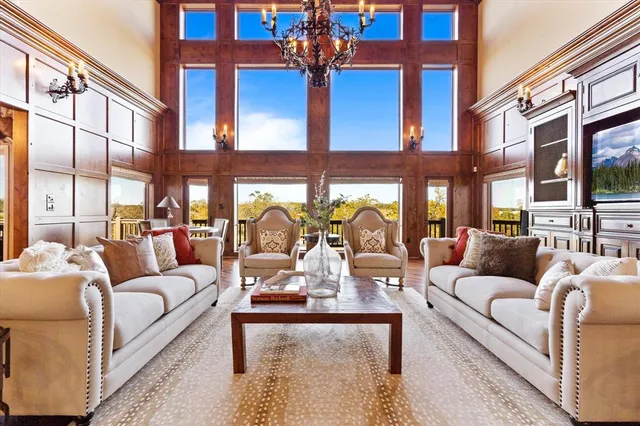 a view of a building with couches chairs and a table