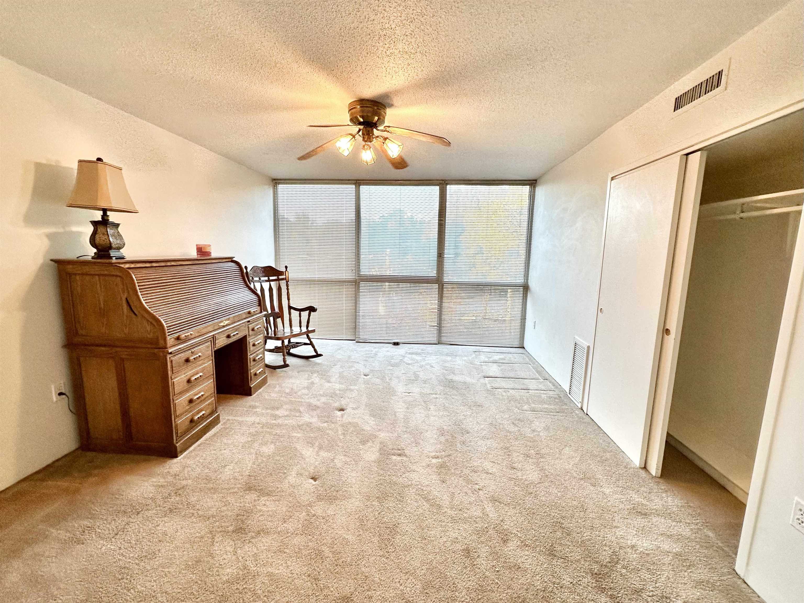 3080 Walnut Grove Road, Unit 404 Memphis, TN 38111 - Photo 5 of 17 a view of a livingroom with furniture and a ceiling fan