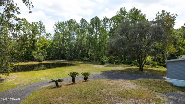 a view of a swimming pool with an outdoor space and seating area