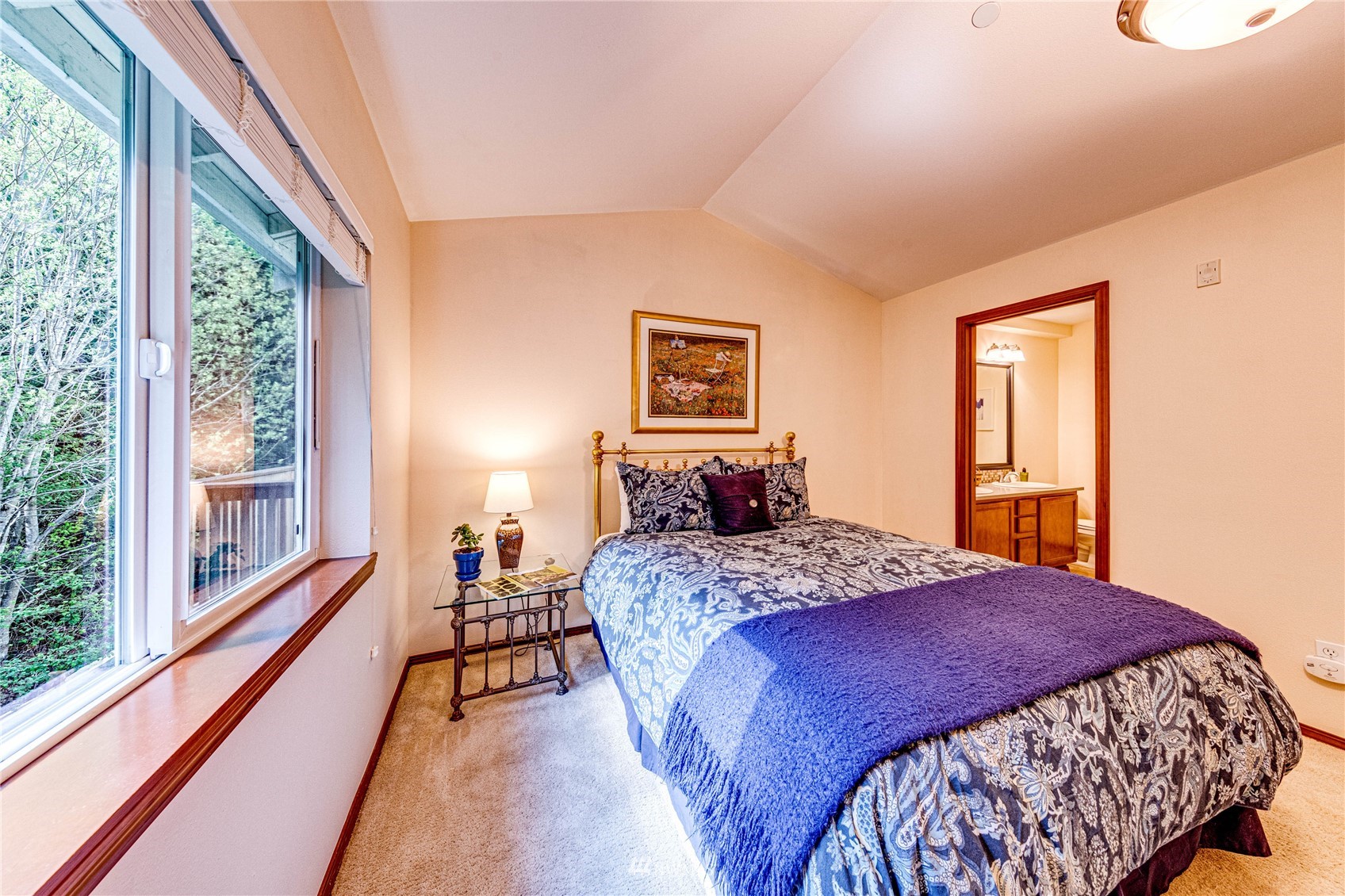 21318 11th Drive Southeast Bothell, WA 98021 - Photo 14 of 27 a bedroom with a large bed and a large window