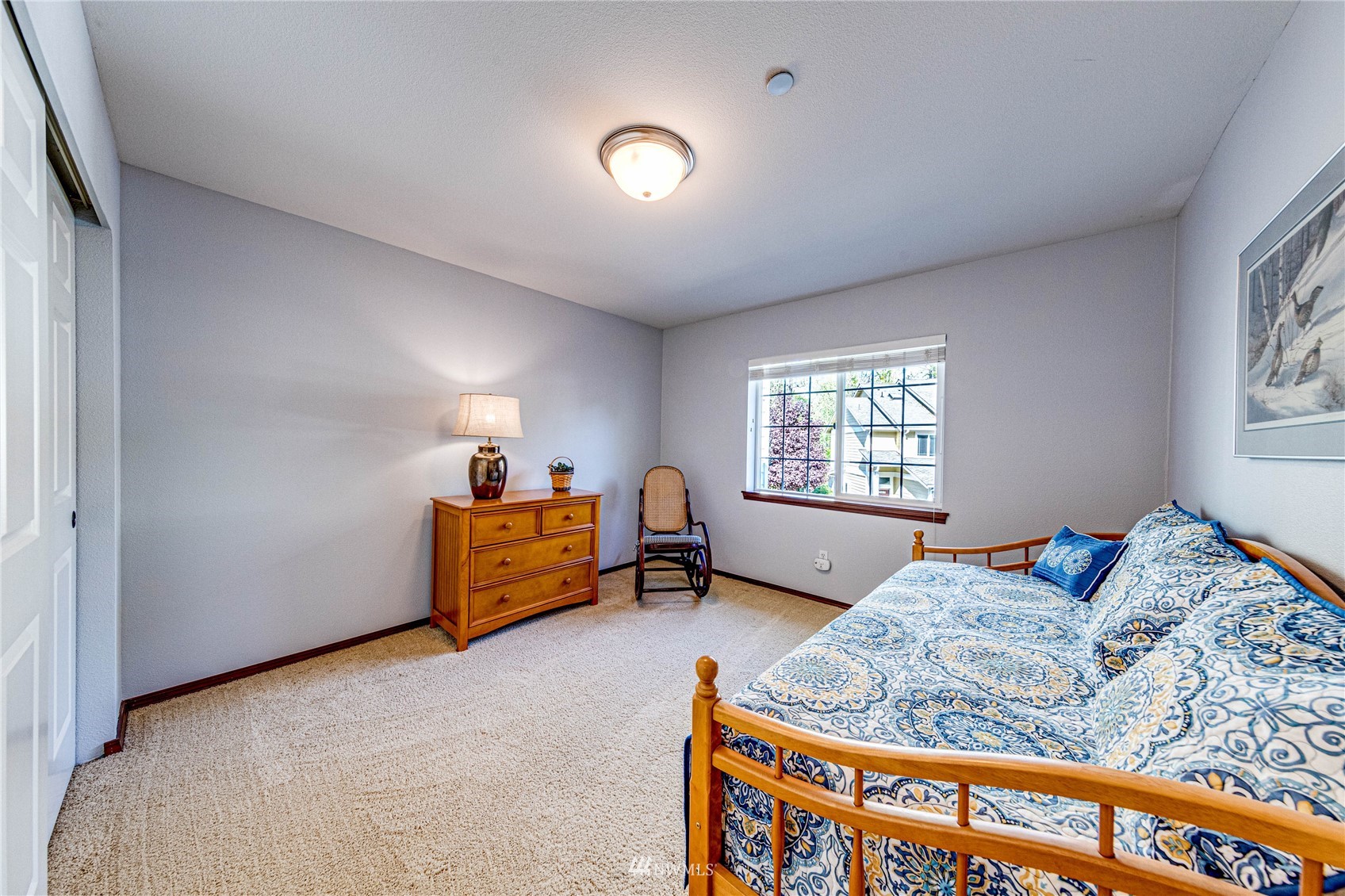 21318 11th Drive Southeast Bothell, WA 98021 - Photo 18 of 27 a bedroom with furniture and a window