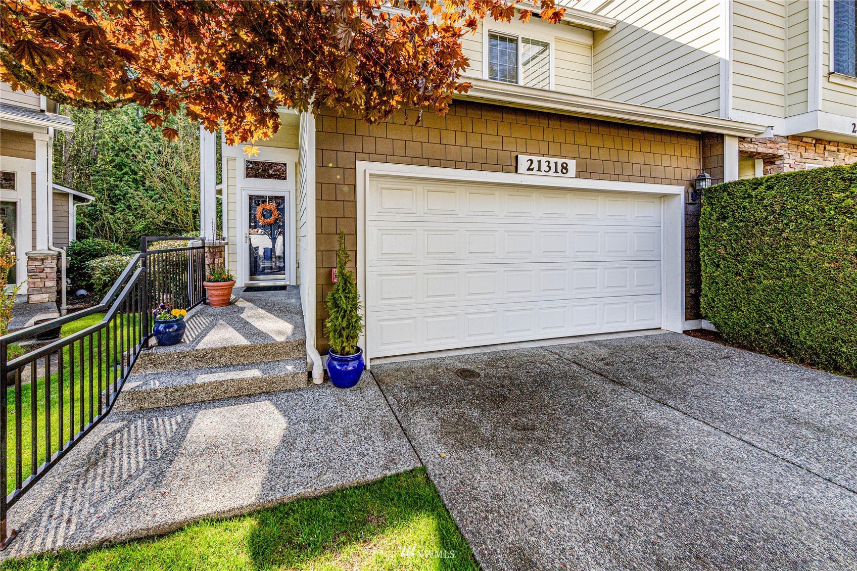 21318 11th Drive Southeast Bothell, WA 98021 - Photo 2 of 27 a front view of a house with garden