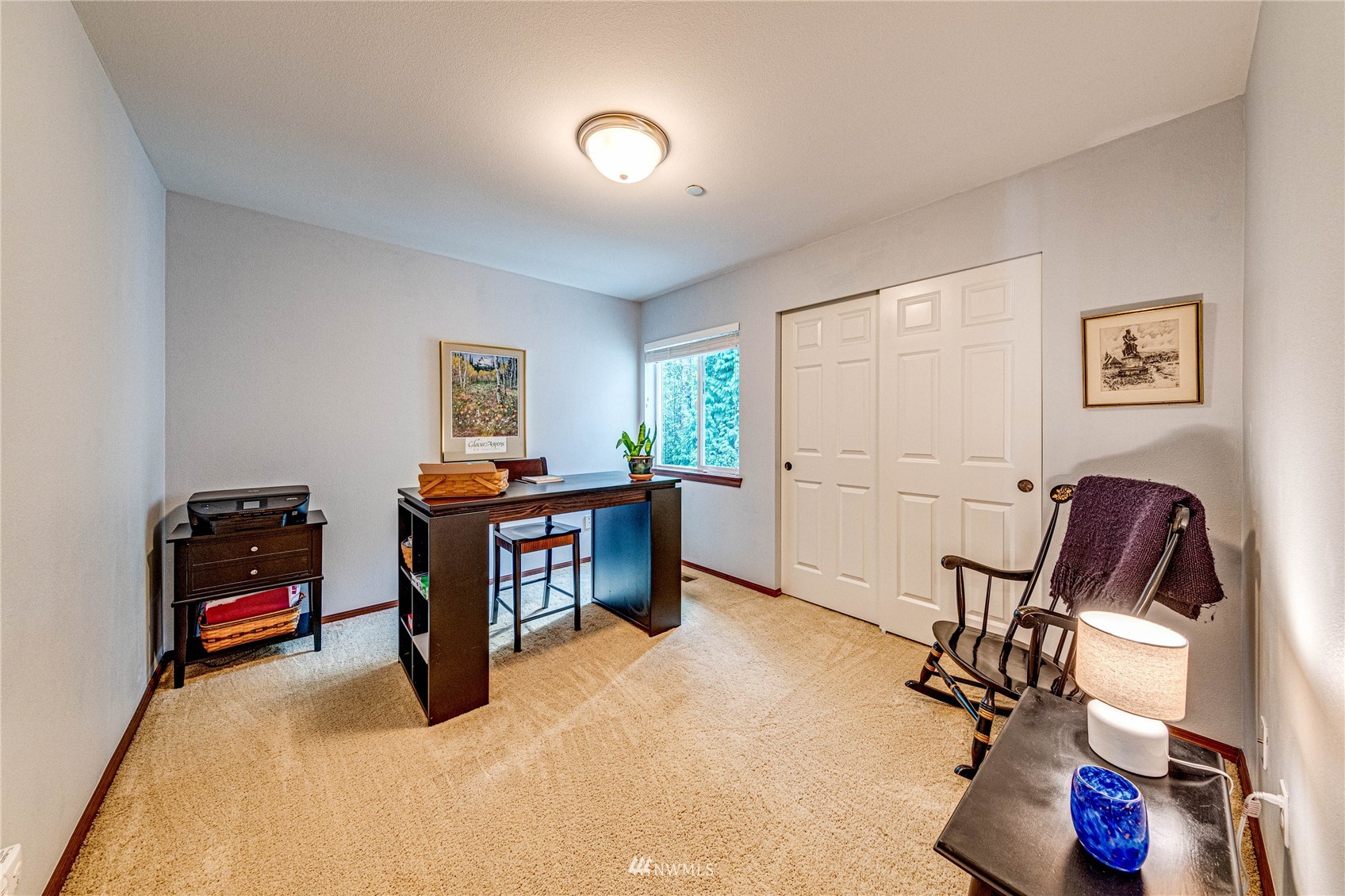 21318 11th Drive Southeast Bothell, WA 98021 - Photo 21 of 27 a view of a workspace with furniture and a window