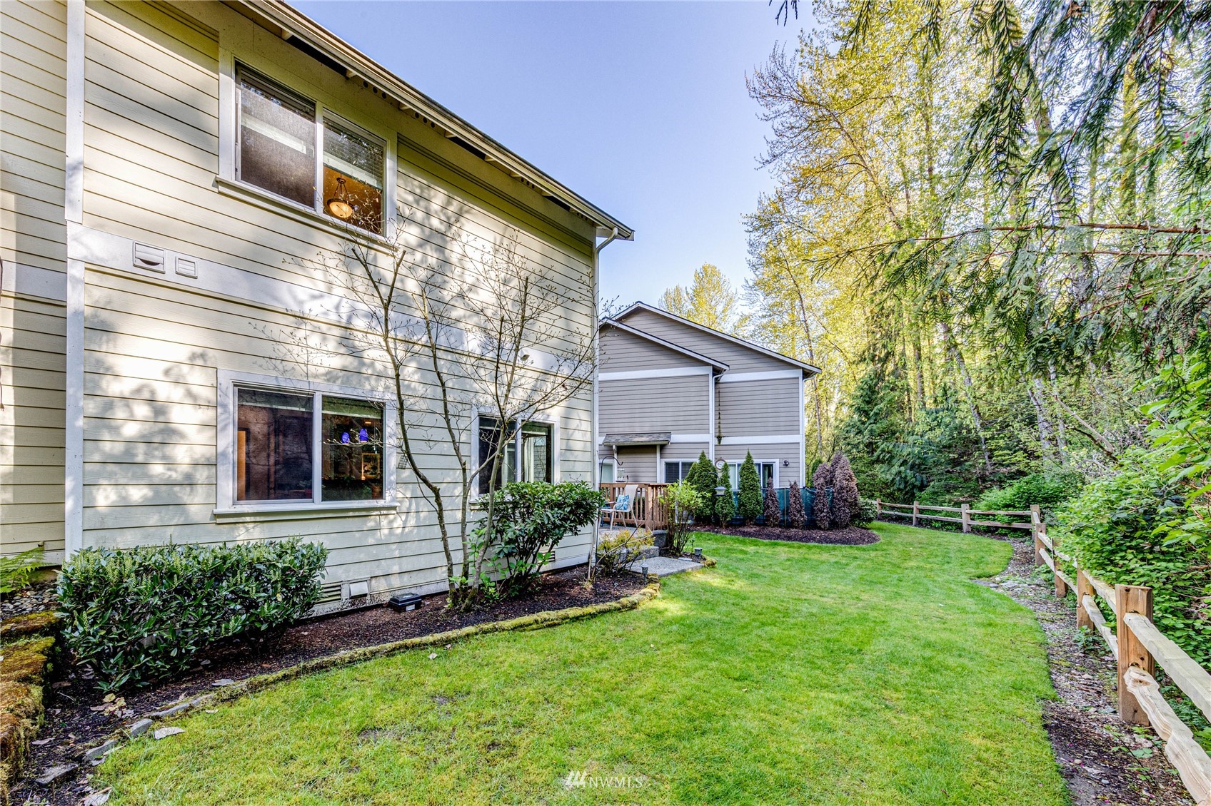 21318 11th Drive Southeast Bothell, WA 98021 - Photo 26 of 27 a front view of a house with a yard and porch