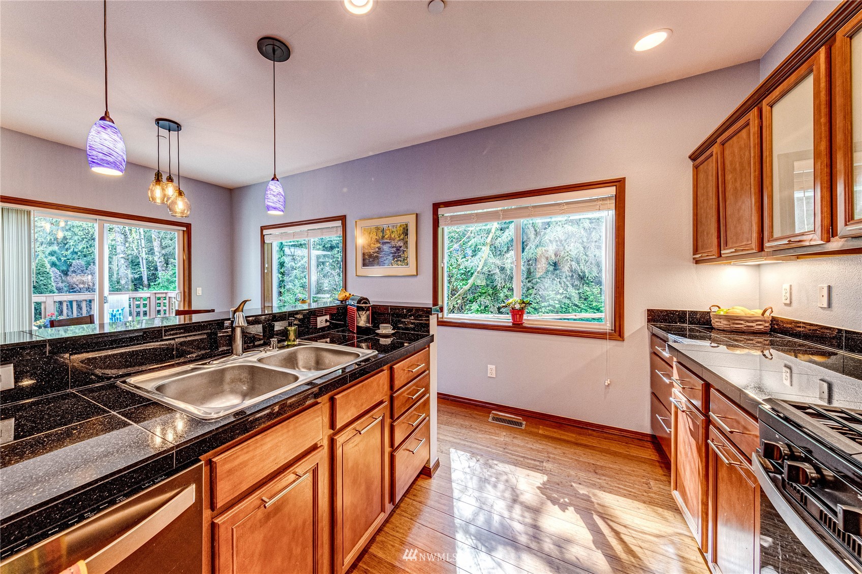 21318 11th Drive Southeast Bothell, WA 98021 - Photo 10 of 27 a kitchen with sink stove and refrigerator