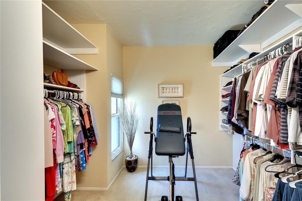 3920 Mariners Way, Unit 311C Cortez, FL 34215 - Photo 12 of 35 a view of walk in closet with clothes