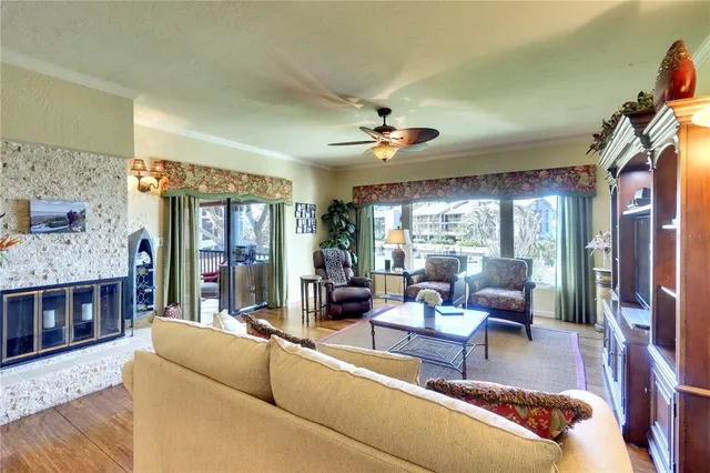 a living room with furniture and a fireplace