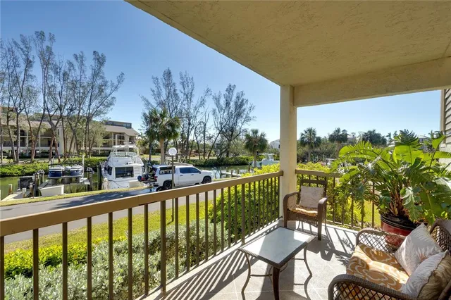 a view of a chairs and table in patio