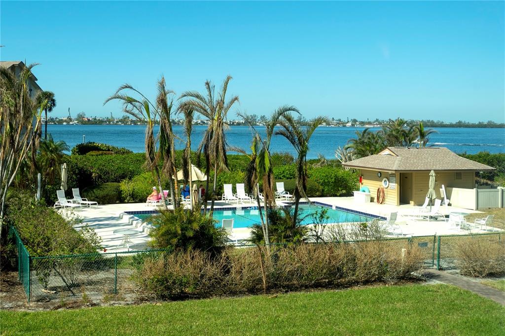 3920 Mariners Way, Unit 311C Cortez, FL 34215 - Photo 28 of 35 a view of a house with a yard and potted plants