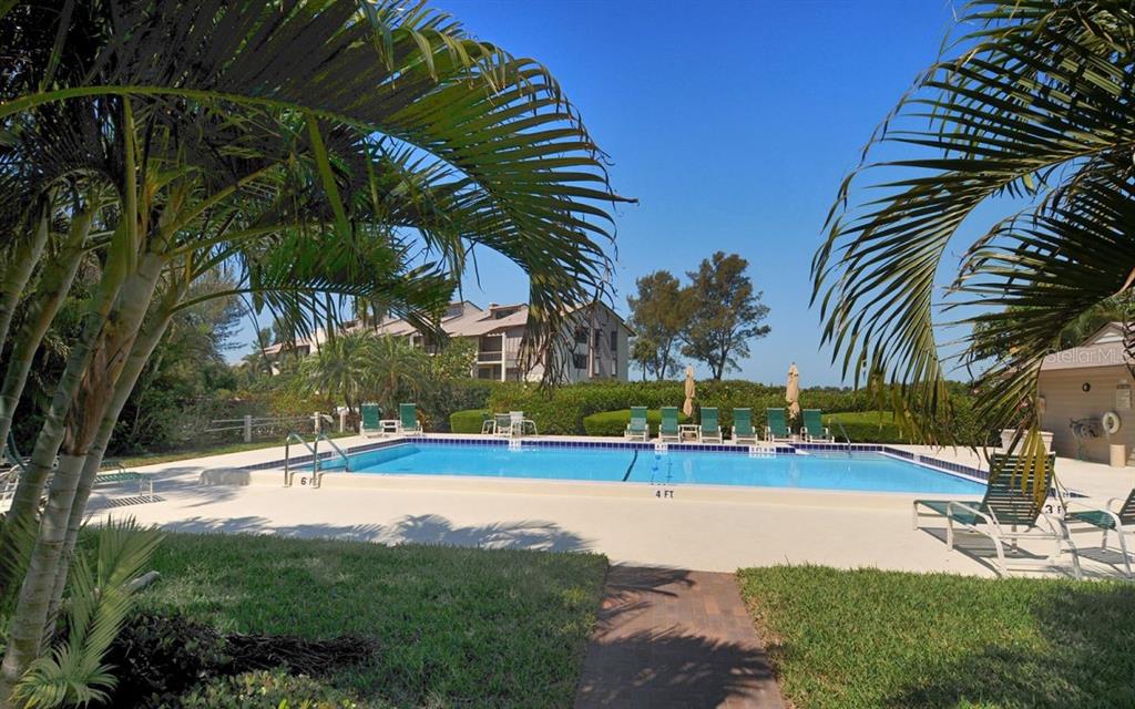 3920 Mariners Way, Unit 311C Cortez, FL 34215 - Photo 33 of 35 a view of a yard and basketball court