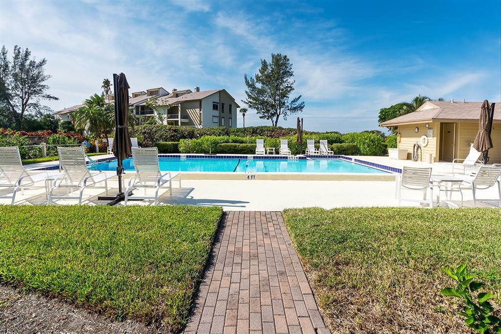 3920 Mariners Way, Unit 311C Cortez, FL 34215 - Photo 35 of 35 a view of a swimming pool with a patio