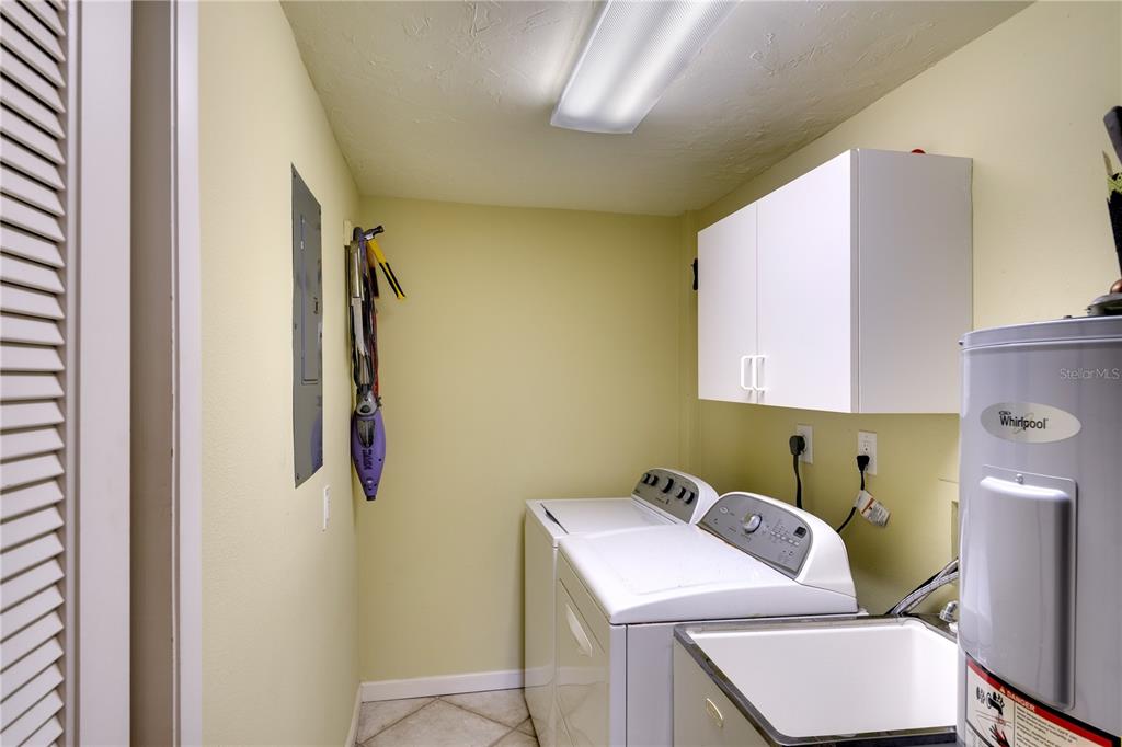 3920 Mariners Way, Unit 311C Cortez, FL 34215 - Photo 6 of 35 a utility room with dryer and washer
