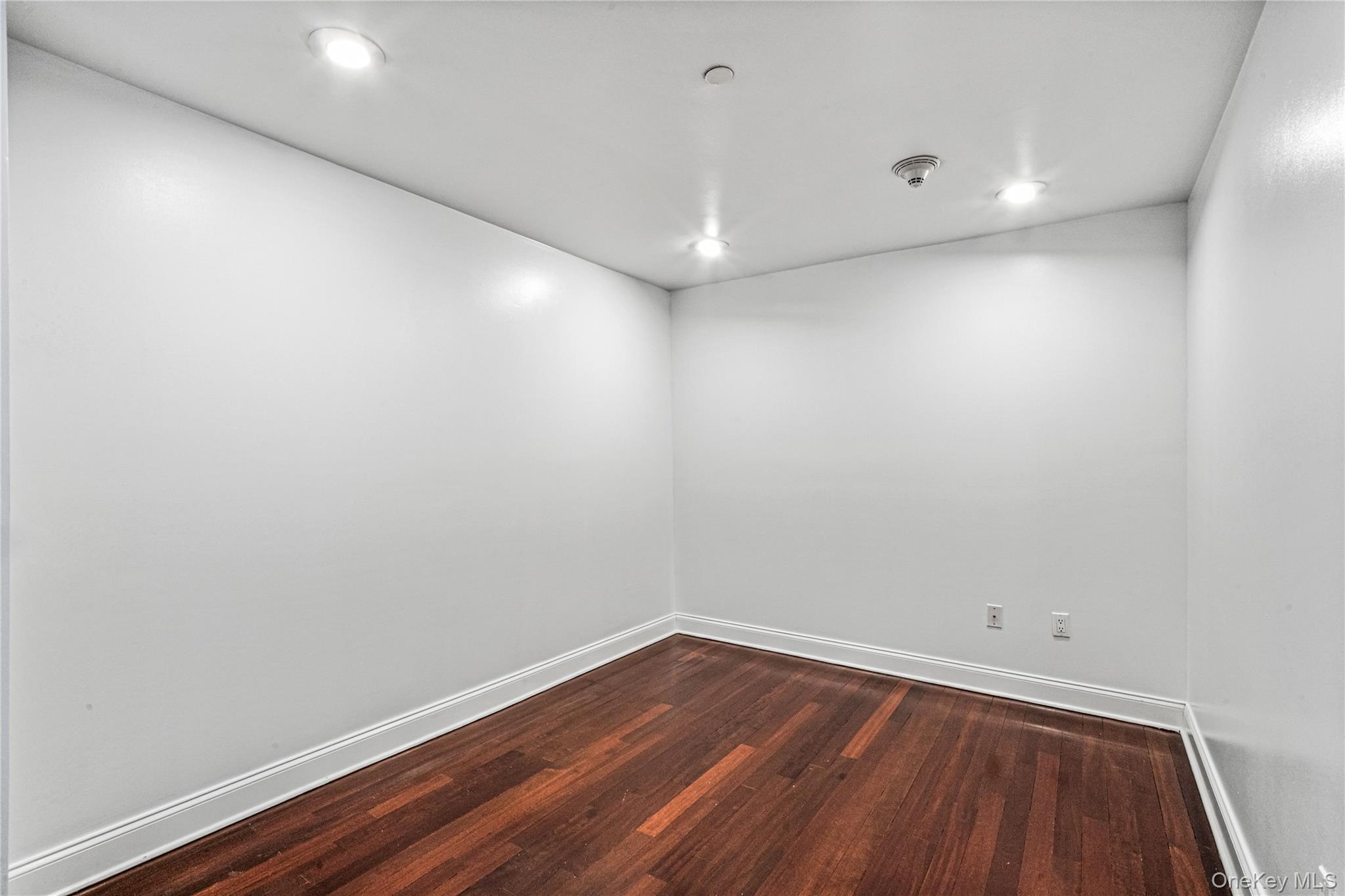 171 Great Neck Road, Unit 4R Great Neck, NY 11021 - Photo 18 of 27 a room and a hard wood floor
