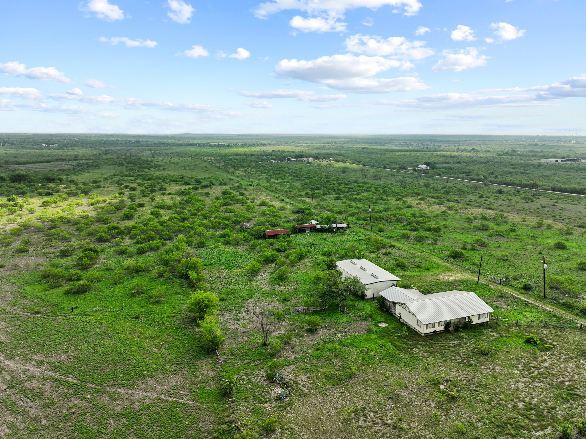 14104 Hokanson Road Del Valle, TX 78617 - Photo 11 of 15 a backyard of a house with lots of green space
