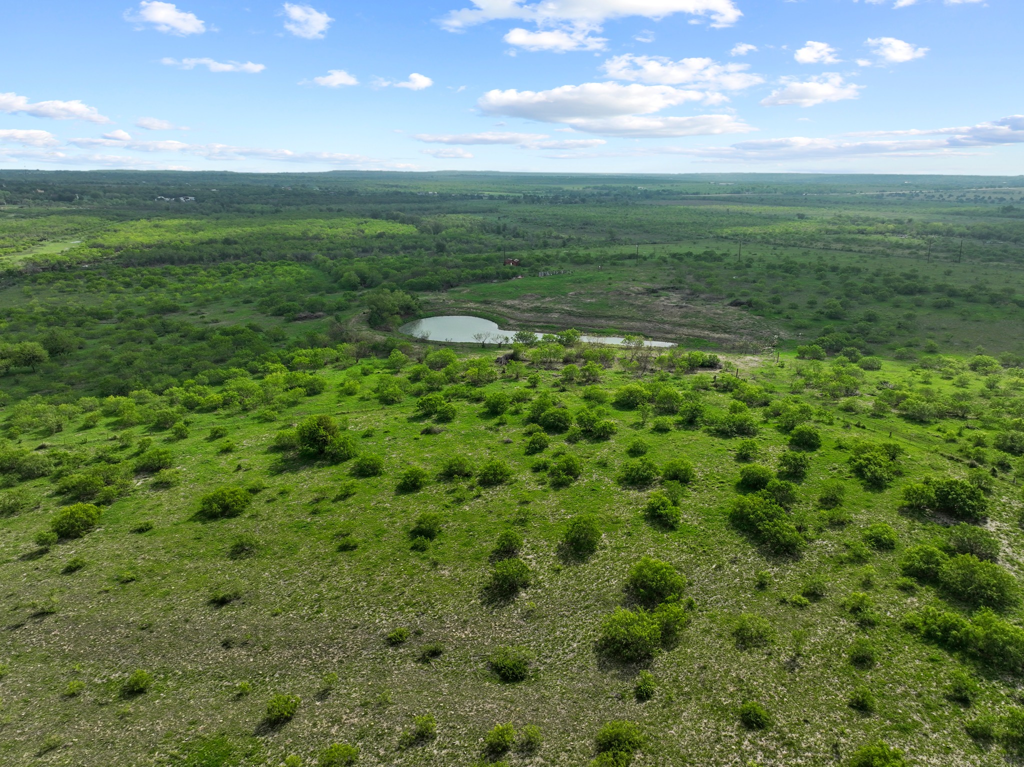 14104 Hokanson Road Del Valle, TX 78617 - Photo 14 of 15 a view of a field with an ocean view