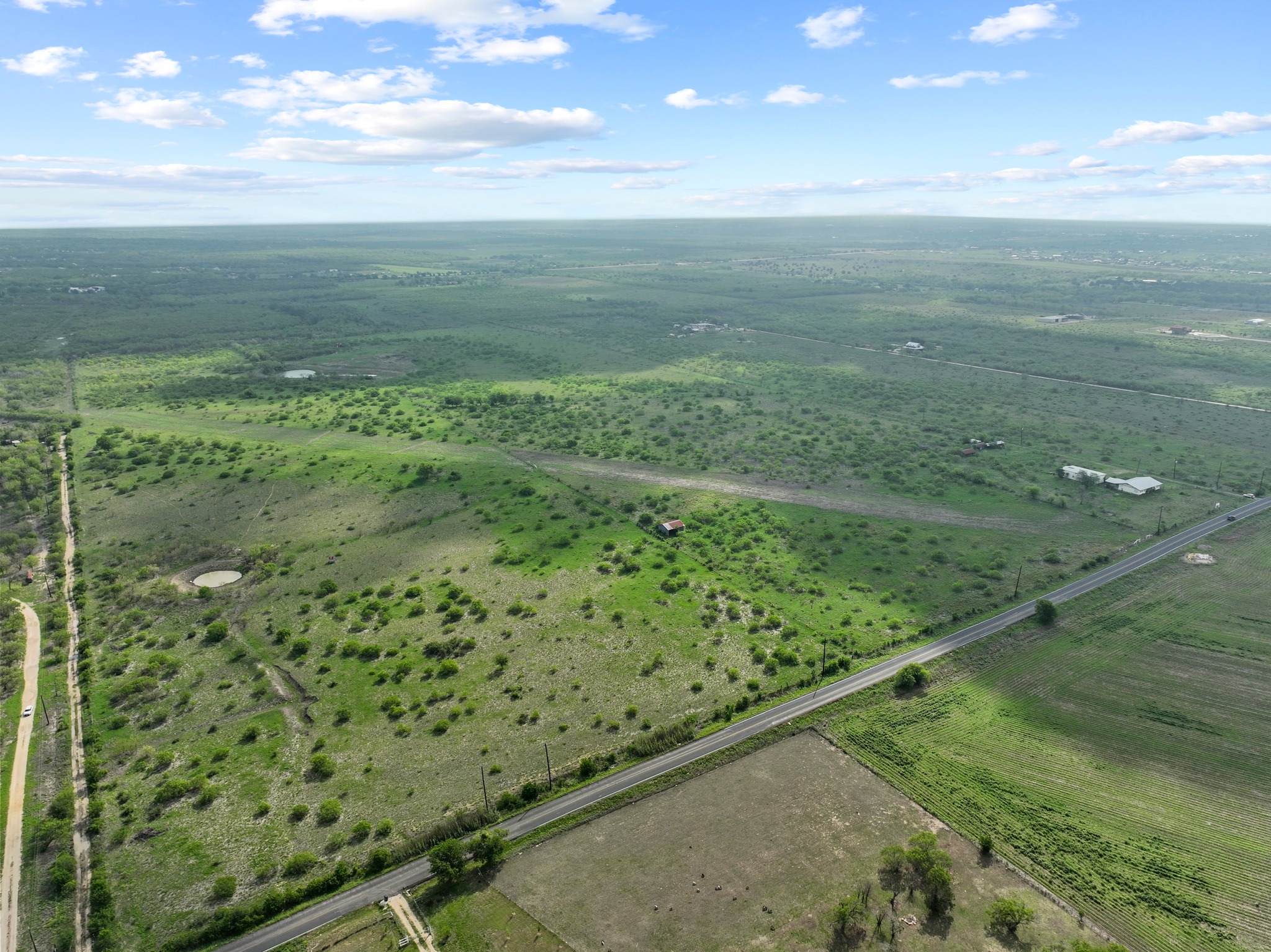 14104 Hokanson Road Del Valle, TX 78617 - Photo 3 of 15 a view of a field with an ocean view