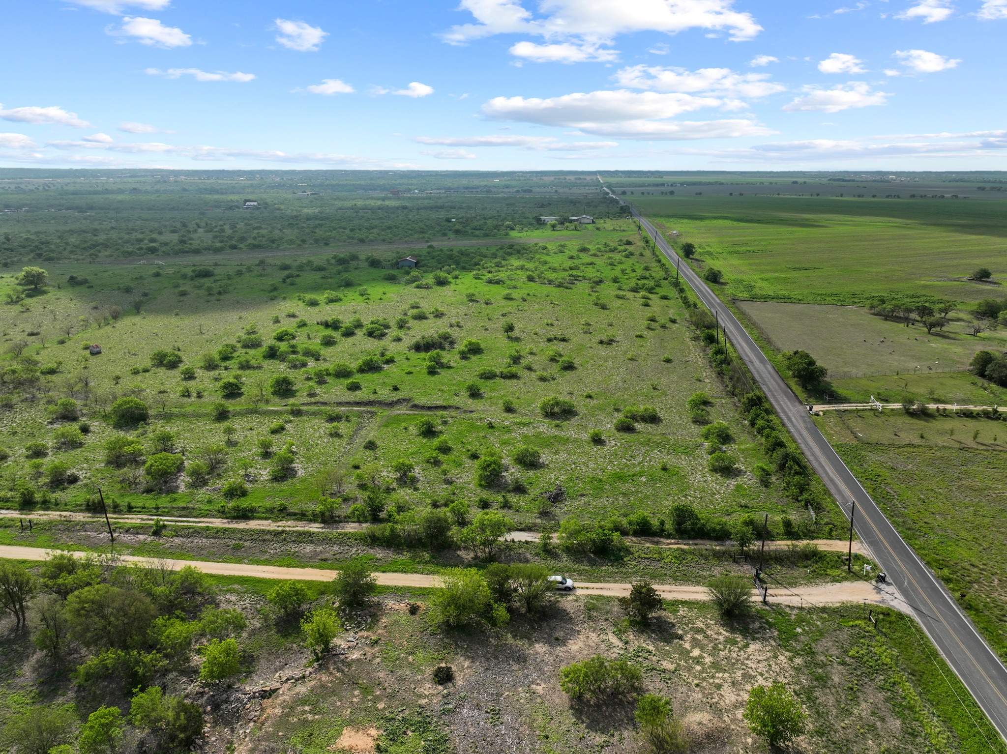 14104 Hokanson Road Del Valle, TX 78617 - Photo 4 of 15 a view of a lake with a yard