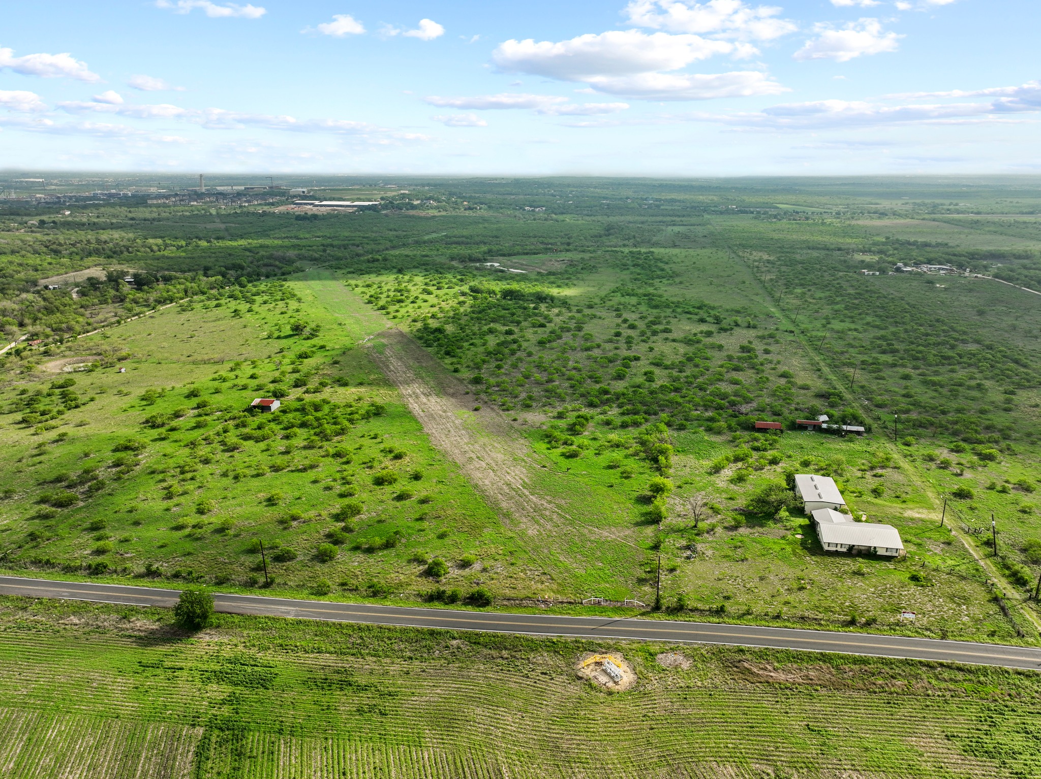 14104 Hokanson Road Del Valle, TX 78617 - Photo 5 of 15 a view of a green field with lots of green space