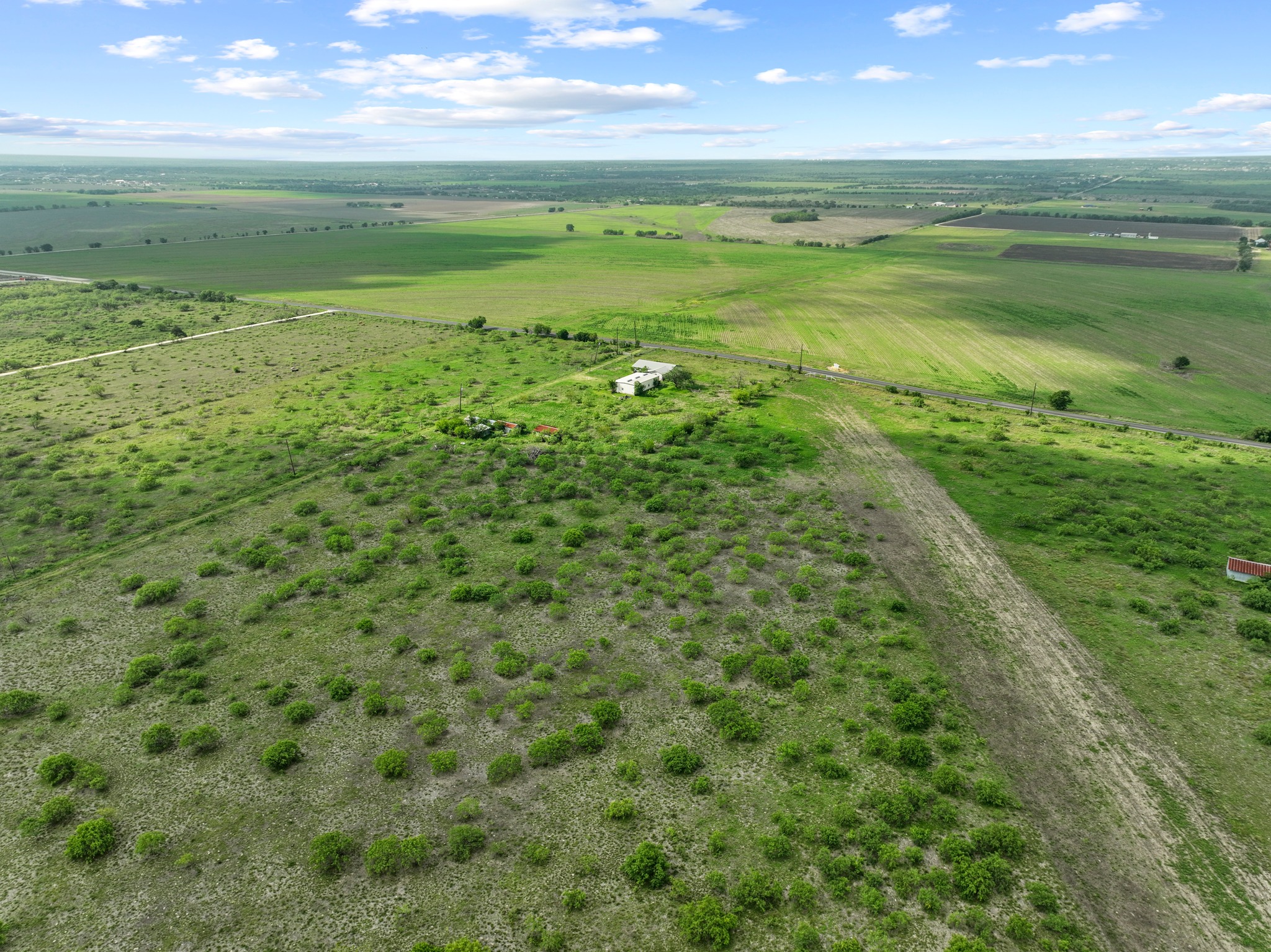 14104 Hokanson Road Del Valle, TX 78617 - Photo 6 of 15 a view of an ocean and a yard
