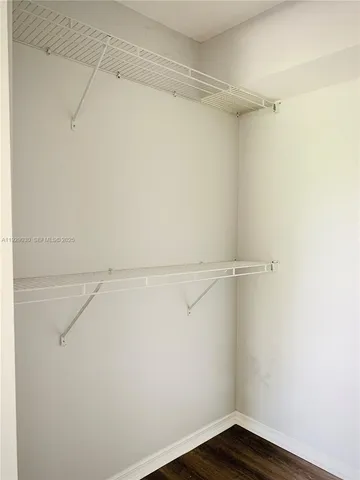 a view of an empty walk in closet