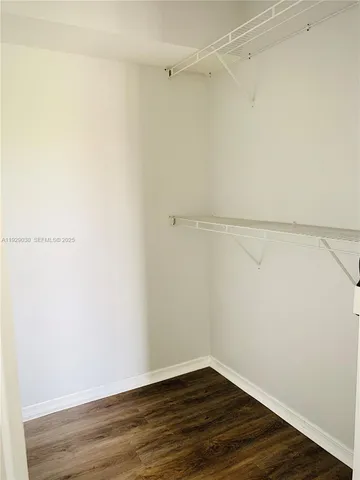 a view of an empty walk in closet