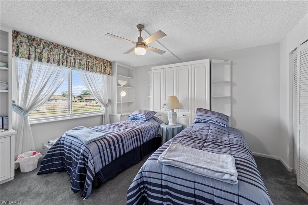 865 Teryl Road, Unit 2114 Naples, FL 34112 - Photo 24 of 50 Guest Bedroom with a Murphy bed and 2 singles